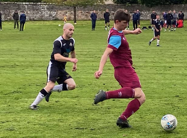 Blair Hardie in the thick of the action for Cupar. By Hayley McHugh