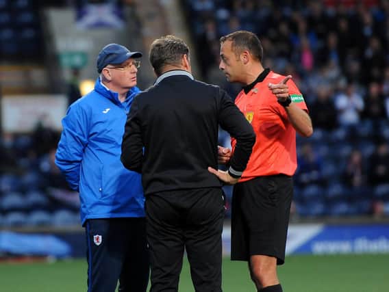 Referee Gavin Duncan speaking with John McGlynn and Peter Grant at the abandoned match earlier this month (Pic: Fife Photo Agency)