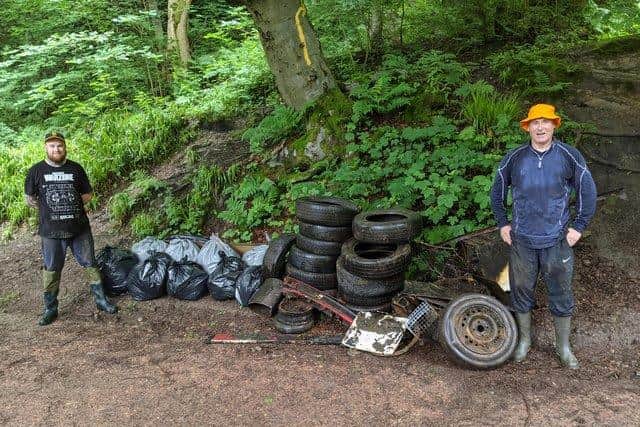Fife Street Champions: Andrew Dunlop is pictured in the left with Keith Wotherspoon on the right with the bags of rubbish and tyres collected from the Den, Cardenden in the summer.