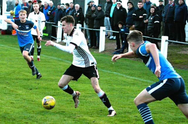 St Andrews United ace Lewis Sawers makes his move against Vale of Leithen last Saturday afternoon (Photo: John Stevenson)