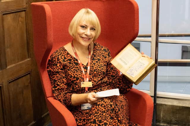 Donna Dewar with the book (Pic: OnFife)