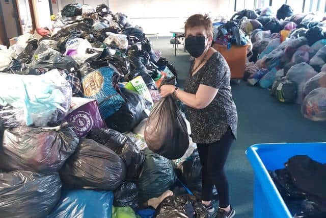 Judy Hamilton with the bags filled filled with donations