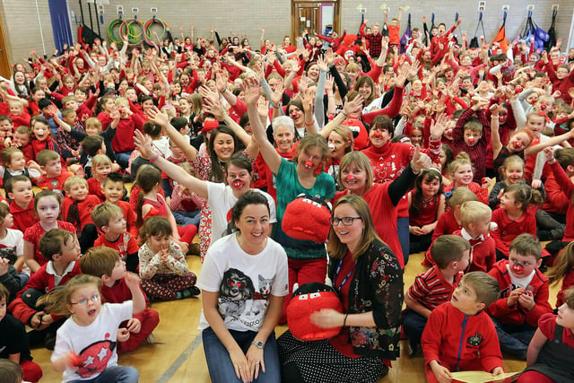 Teachers joined in the Red Nose Day fun at Castlehill Primary in Cupar in 2017.
The boys and girls, who each donated £1 to dress in red, manned stalls selling cakes made with the help of parents and also ran a nail bar. In addition, there was a competition to guess the number of balloons in a Mini car. 
The fun was rounded off with the whole school singing the Red Nose Day Song.