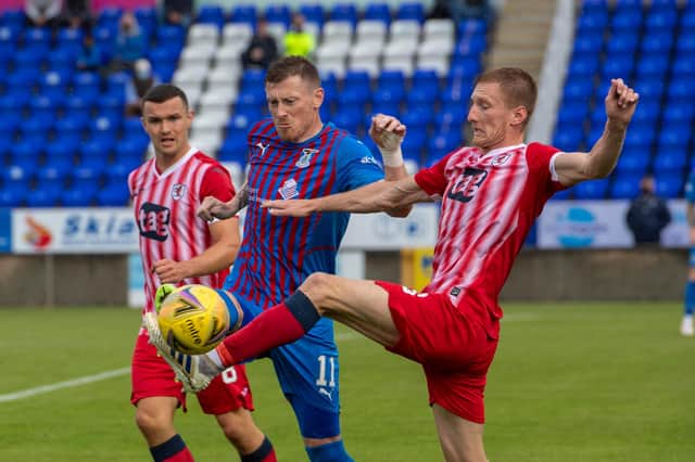 Liam Dick challenges Caley's Shane Sutherland. (Pic: Trevor Martin)