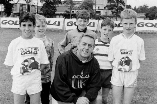 Former Liverpool and Scotland star Ian St John hosting his annual soccer camp, staged at Kirkcaldy High School in summer holidays, late 1980s. Pic by Bill Dickman, chief photographer of the Fife Free Press