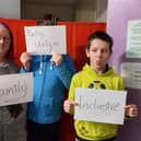 The song's music video features Autism Rocks Fife members holding signs that show what the charity means to them (Pic: Autism Rocks Fife)