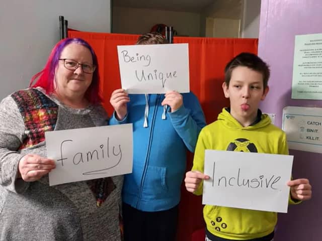 The song's music video features Autism Rocks Fife members holding signs that show what the charity means to them (Pic: Autism Rocks Fife)