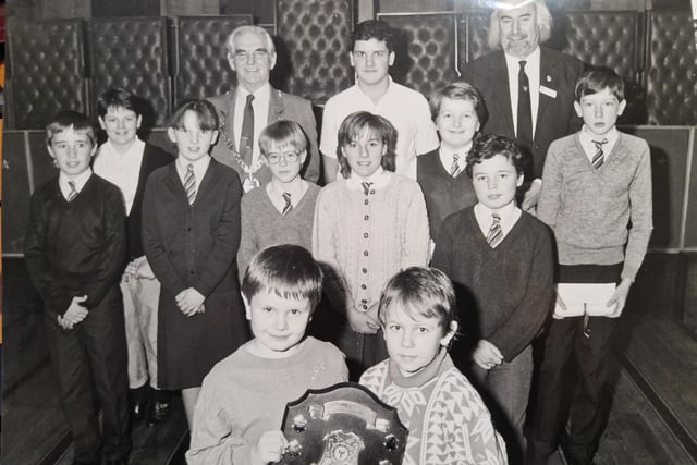 A step back to 1988 for these environmental awards winners from Rimbleton Primary School and Star Youth Club. Pictured are Tony Kivistik and Louise Riggs with their shield. Among those looking on are Convener Bob King and local councillor Tom Dair (right). Picture taken by David Cruickshanks, staff photographer, Glenrothes Gazette.