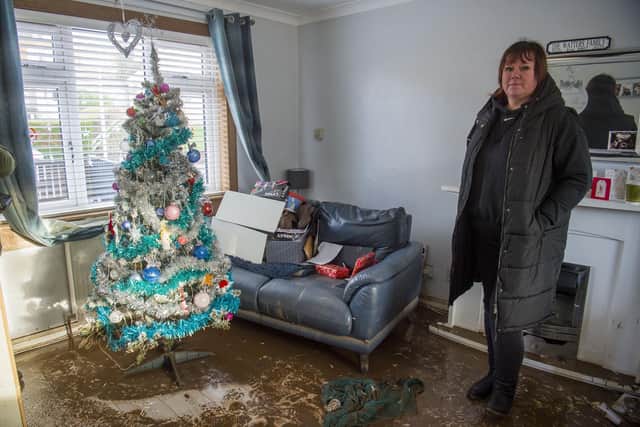 Kinloss Park, Cupar resident Carol Watters looks at the flood damage in her property (Pic: Lisa Ferguson)