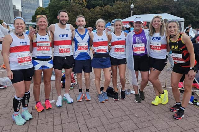 Fife Athletic Club's Hilary Lalande, Michelle Johnstone, Kevin Wallace, Andy Lafferty, Alison Sutherland, Laura Muir, Kellyanne Muir and Michaela McLean with PH Racing Club's Izzie Robertson on the start-line of the Chicago Marathon