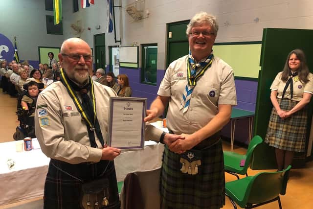 Roger Mitchell (left) with his Silver Wolf award after being presented by Callum Farquhar who is Scouting's regional commissioner for East Scotland