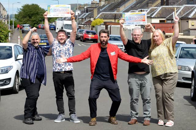 James McMillan and Andrew Rogers, and Thomas and Karen Couper, are joined by People’s Postcode Lottery ambassador Matt Johnson top celebrate their win.