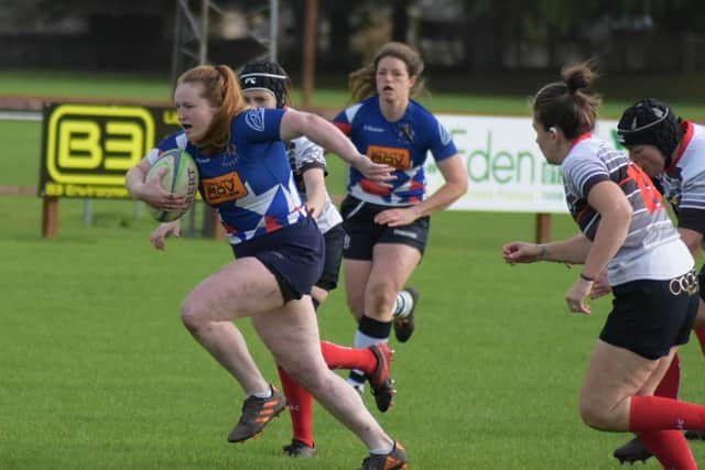 Emma Wood, the club's vice-captain, storms over to score the first try of the game. Pic by Cordelia Manson