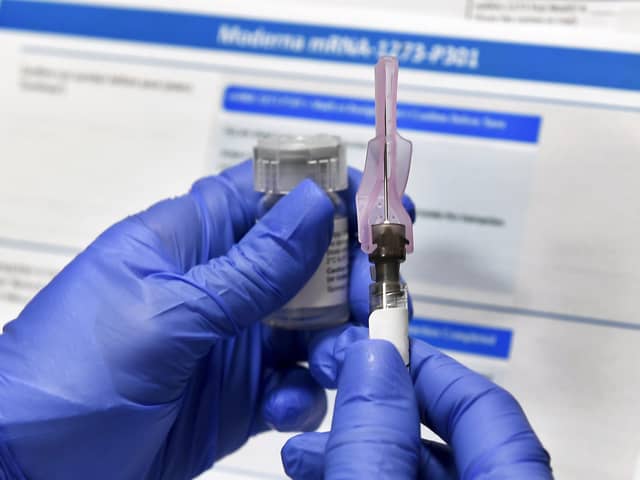 A nurse prepares a syringe to administer a Covid vaccine. Picture: AP Photo/Hans Pennink