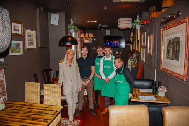 Licensee Lauren Hutchison with her staff at newly opened Alfie's in Kirkcaldy High St. Pic: Scott Louden.