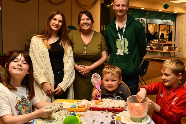Volunteers Katarina Marneros and Luke Ramage with Lynne Scott and some of the youngsters enjoying the arts and crafts at the birthday celebrations. Pic: Fife Photo Agency.