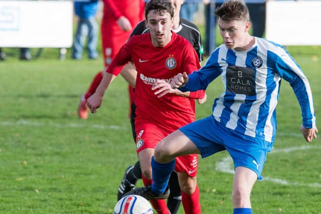 Reece Ritchie, seen here in red playing for Lochee, is one of Chris Macpherson's summer signings. Pic by Ian Georgeson