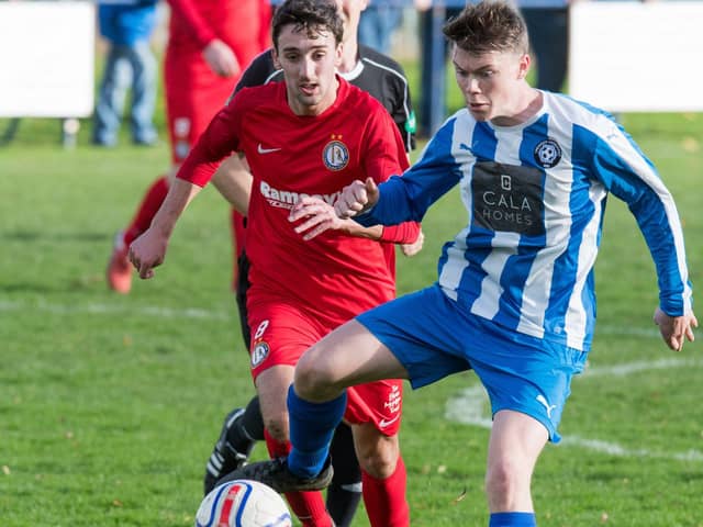 Reece Ritchie, seen here in red playing for Lochee, is one of Chris Macpherson's summer signings. Pic by Ian Georgeson
