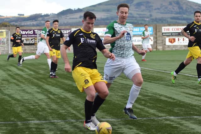 Chris Higgins chases down Dumbarton's Paddy Boyle