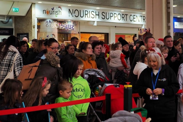 Crowds gather in the Mercat for the shopping centre's Christmas light switch on.