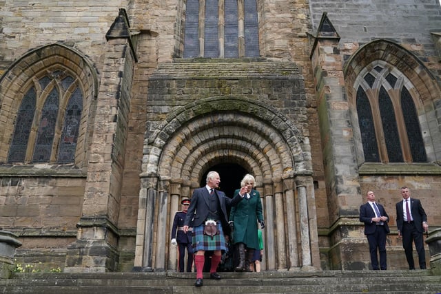 King Charles III and the Queen Consort leave Dunfermline Abbey, after a visit to mark its 950th anniversary, and after attending a meeting at the City Chambers in Dunfermline, Fife, where the King formally marked the conferral of city status on the former town.