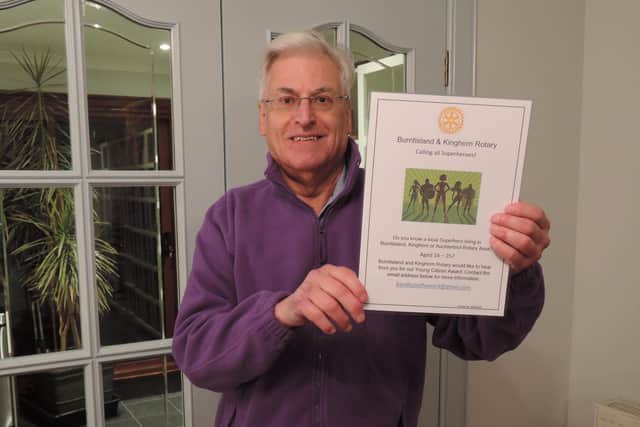 Roger Diggins,  Rotary Club of Burntisland & Kinghorn past president and chairman of the community service/youth committee, with a poster calling for nominations for the new Young Citizen Award.