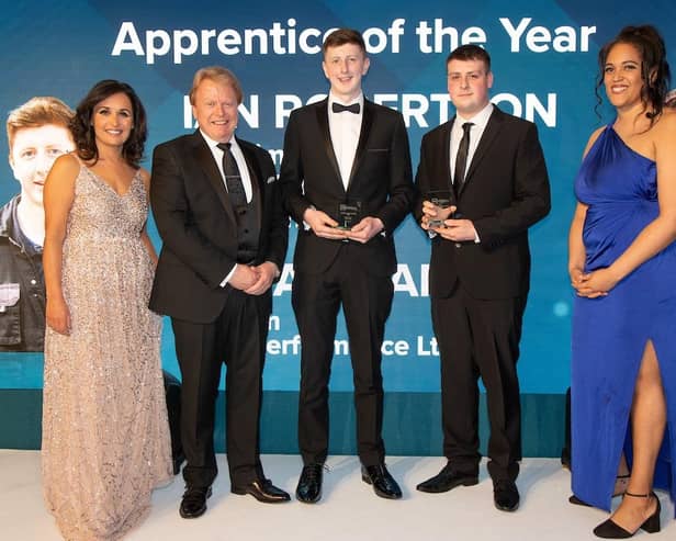 Ian Robertson (centre) receiving his Apprentice of the Year Award at the IMI Annual Awards in London.