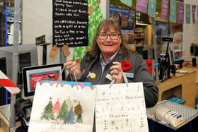 Carole-Anne Paterson with gifts at the 'giving tree' in the Co-op to help give local children a gift this Christmas.  Pic: Fife Photo Agency.