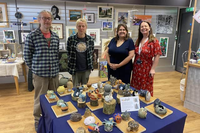 Members of Kirkcaldy Art Club with Lynne Scott from Nourish and the clay creature creations.  (Pic: submitted)