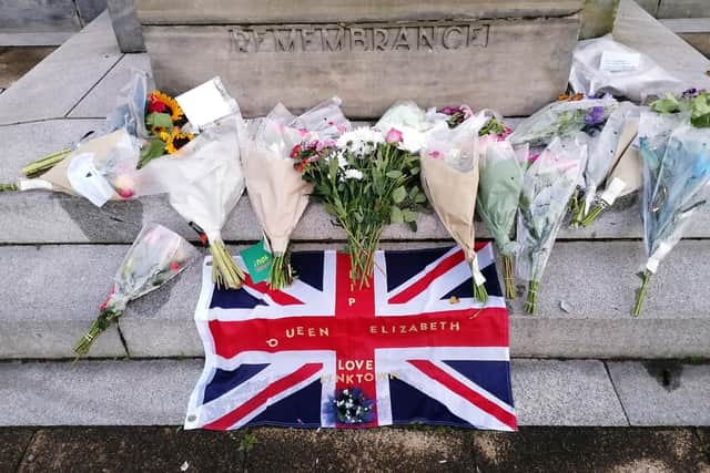 Flowers left at Kirkcaldy War Memorial for The Queen