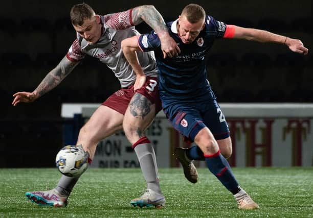 Raith Rovers captain Scott Brown tackling Arbroath substitute Ali Adams during their sides' 2-2 draw at Kirkcaldy's Stark's Park on Saturday (Photo by Paul Byars/SNS Group)