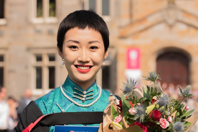 MA (Hons) Philosophy graduate Luna Guan, from Beijing, in traditional Chinese dress.