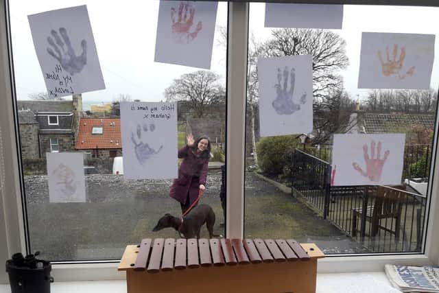 A display of hands has been put up with messages.