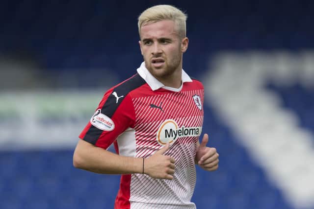 Raith Rovers forward Lewis Vaughan investigating whether blondes really do have more fun whilst playing against Ross County in Dingwall in July 2016 (Pic: SNS Group/Craig Williamson)