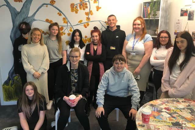 Some of the staff and young people who were involved with creating the wellbeing room.