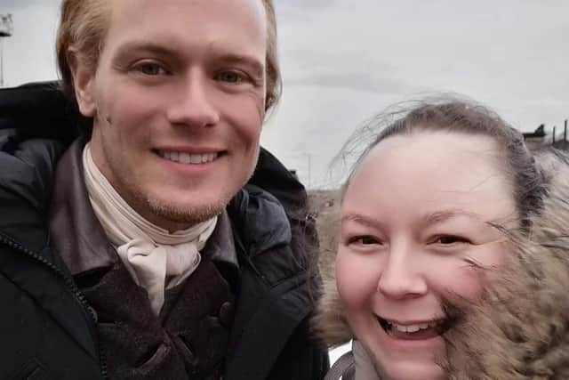 Scottish actor Sam Heughan, who plays Jamie Fraser in Outlander,  pictured on set in Burntisland with Fife fan Louise McLean from Kinghorn. Pic: Louise McLean.