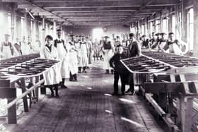 An early image of workers in the factory at AH McIntosh