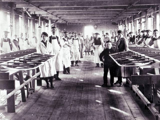 An early image of workers in the factory at AH McIntosh