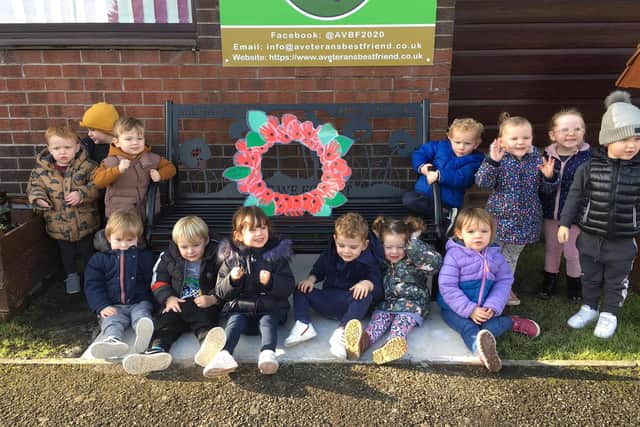 Children from the centre's Happy Hoppers Playgroup with their wreath made out of hand prints.