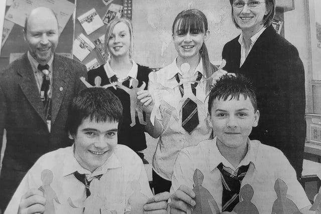Kirkcaldy High School pupils prepare for a trip to Malawi. 
Pictured: from left Kenneth Bease (teacher), Kate Campbell, Jennifer Lee and teacher Corinne Meek. In front are Philip Duffy and Andrew Fleming with the Joined-Up Campaign cut outs