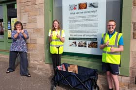 Keren Brynes MacLean, Alex Thomson and Jack Wilson outside Health Food and More.