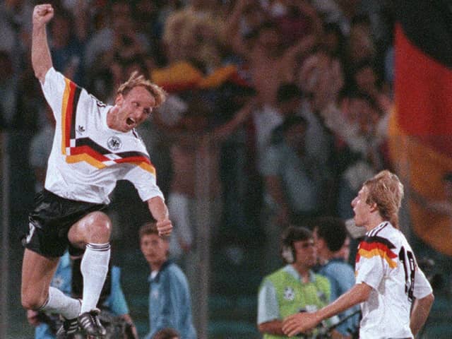 Andreas Brehme leaps high to celebrate in front of West Germany team-mate Jurgen Klinsmann after scoring the winner in 1990 World Cup final (Pic Georges Gobet via Getty Images)