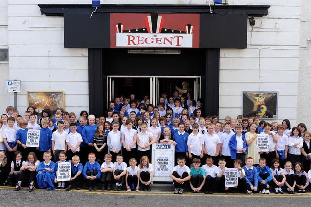 Pupils from Parkhill Priamry School re-create a 1930s Daily Record photo of local kids visiting the Regent Cinema, Leven