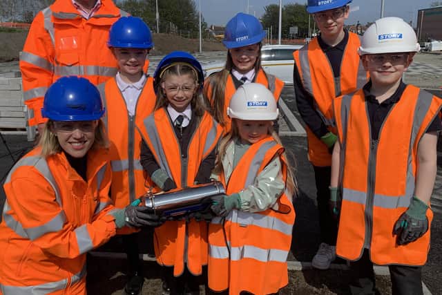MSPs David Torrance and Jenny Gilruth with pupils from Parkhill Primary burying a time capsule at the new Leven station.  Pupils pictured are Arden Soutar (P1); Aria Soutar (P4); Kasey Edwards (P4); Archie Masson (P3) and Rory Masson (P7)  (Pic: Network Rail)