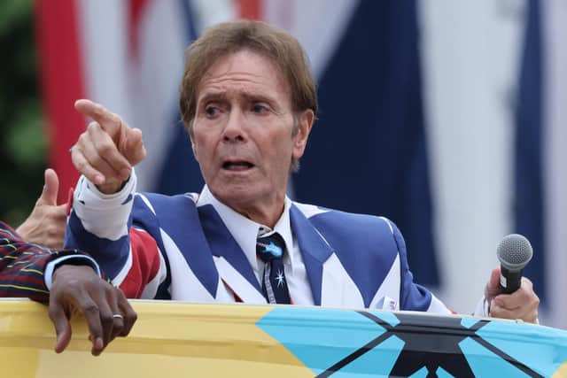 Cliff Richard rides on an open top bus as he takes part in a parade during the Platinum Pageant  (Photo by Richard Pohle - WPA Pool/Getty Images)