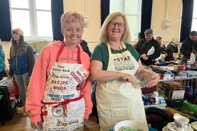 Big Green Market volunteers Susan and Lesley.  There's around 60 volunteers who help keep the popular pre-loved market running.  (Pic: submitted)