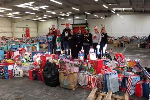Fifers are being urged to drop off donations for the appeal before December 5. Pictured are some of the volunteers with gifts from last year's appeal.