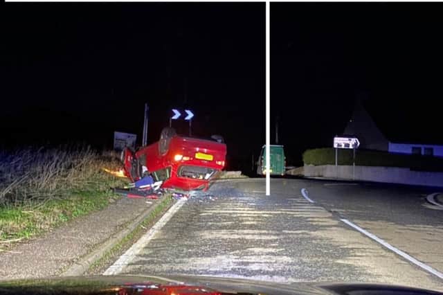 A red car overturned near a turn on the B921 in Fife (Photo: Police Scotland).