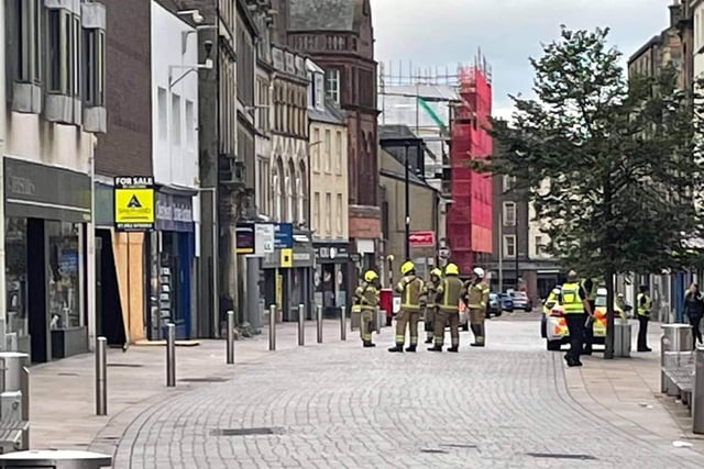 Fire crews on Kirkcaldy High Street as colleagues on the adjacent Hill Street tackle the blaze at the back of the former WHSmith store