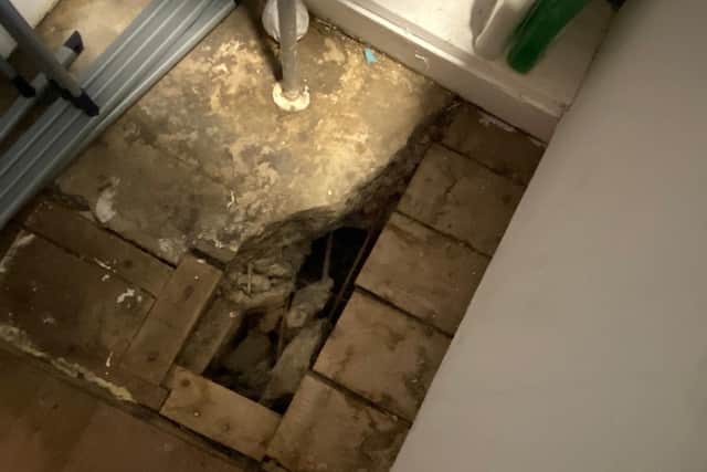 Hole in the bathroom floor - one of the issues raised